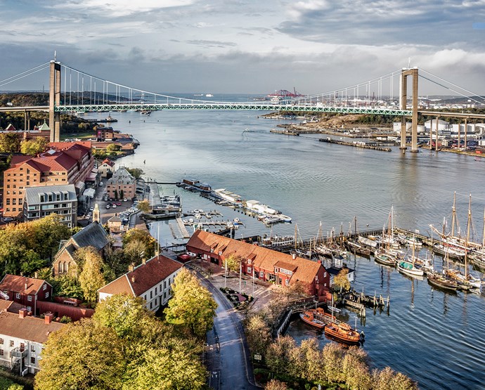 Panoramic view of Gothenburg, showcasing the city's waterfront, modern buildings, and green spaces during a sunny day